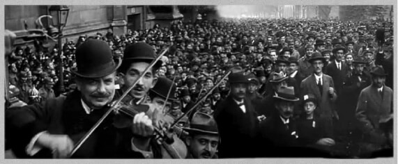 Violinists playing in front of crowd in Budapest in 1918