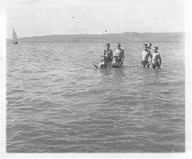 Gyula with Ari and cousins standing thigh-deep in the shallow waters of Lake Balaton in 1940