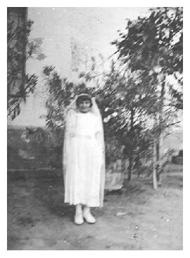 Ari posing in her Communion dress in Marcali Hungary in 1940