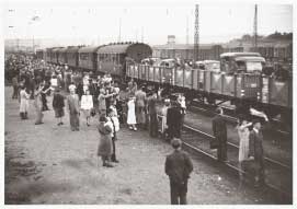 Hungarian soldiers in railway cars and civilians waving goodbye in 1942