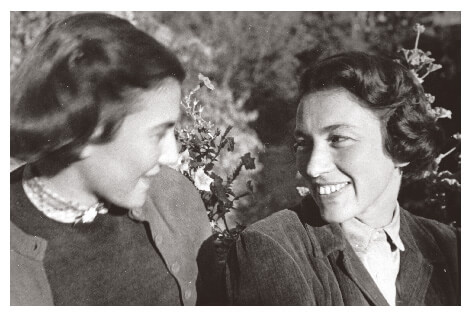Two women friends smiling in Hungary in 1953