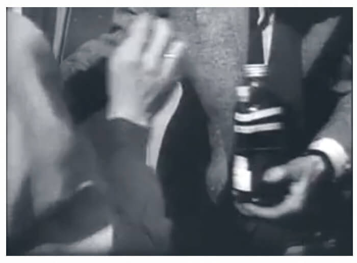 Video footage showing freedom fighters passing along Molotov cocktails during the 1956 Hungarian Revolution