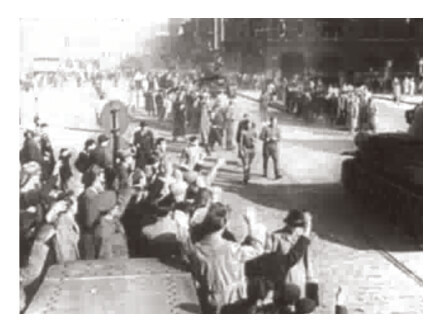 Looped video footage showing jubilant Hungarian revolutionaries celebrating on captured Soviet tanks during the 1956 Hungarian Revolution.