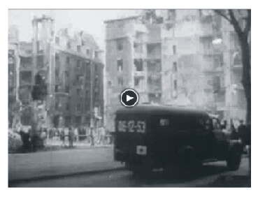 Looped video footage showing Medics running to assist people during the 1956 Hungarian Revolution.