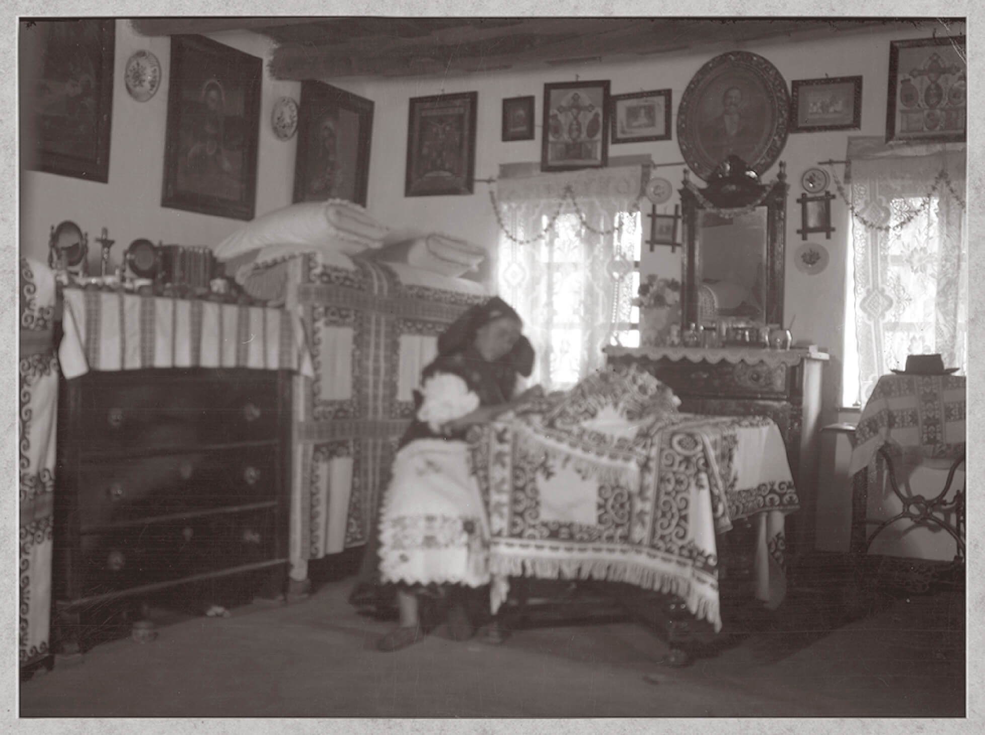 Hungarian Peasant woman embroidering at home