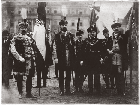 Hungarian men wearing diszmagyar costumes