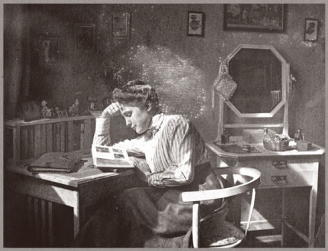 A woman reading in 1910