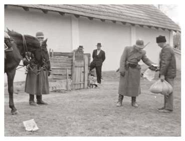 Police inspectors checking bags of grain during the Rákosi era