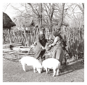 Policemen monitoring kulaks on a farm in Hungary in 1950