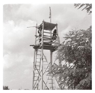 Policemen monitoring collective farm workers in Hungary in 1950