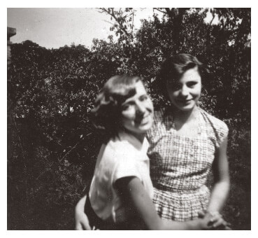 Two women friends smiling in Hungary in 1953