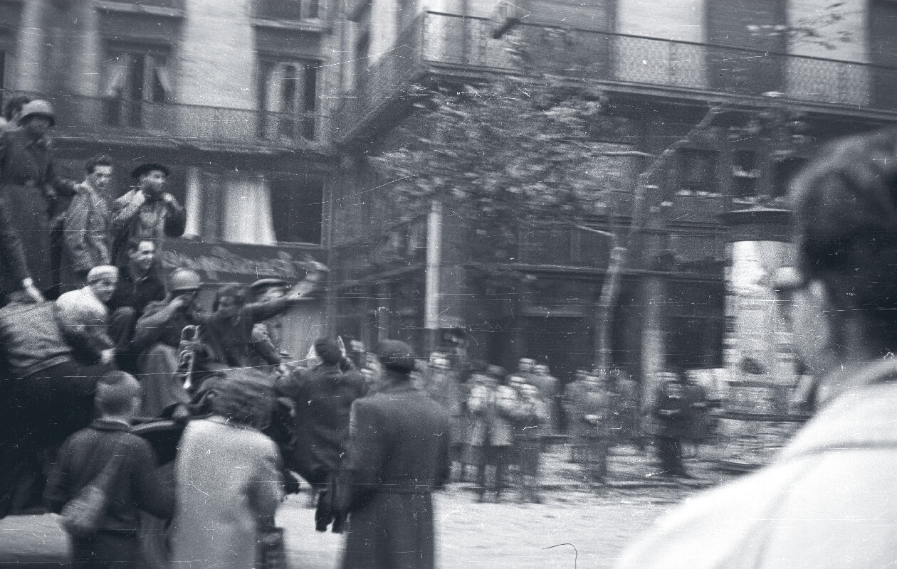 Freedom fighters riding on tanks during the 1956 Hungarian Revolution