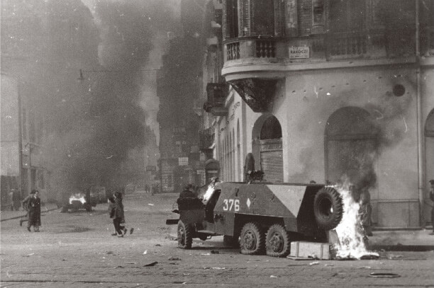 Burning armored shotgun vehicle during the 1956 Hungarian Revolution