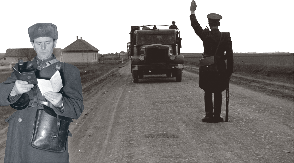 Hungarian border policeman checking papers during the aftermath of the 1956 Hungarian Revolution