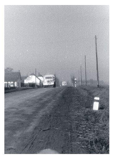 a large truck comes down a deserted road near the border