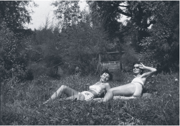 Ari sunbathes with a friend on Lake Balaton around 1960