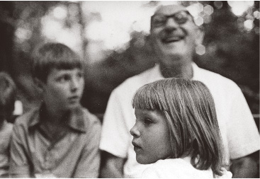 Pista laughs with Laci looking on and with Bettina in the foreground