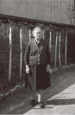 An elderly Gizi walks down a Keszthely street in the early 1990s